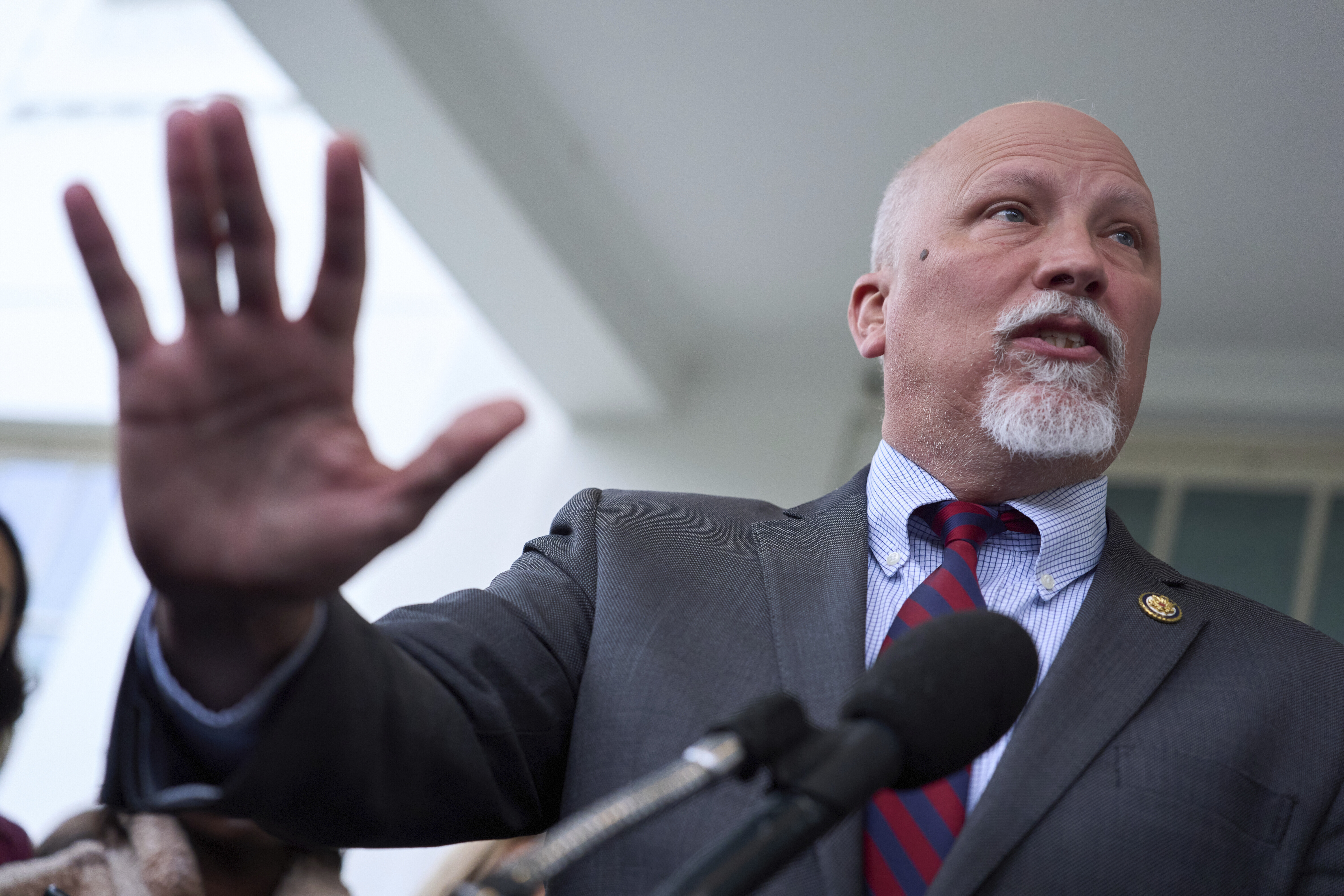 Chip Roy speaking and holding up his hand. Chip Roy speaking and holding up his hand.